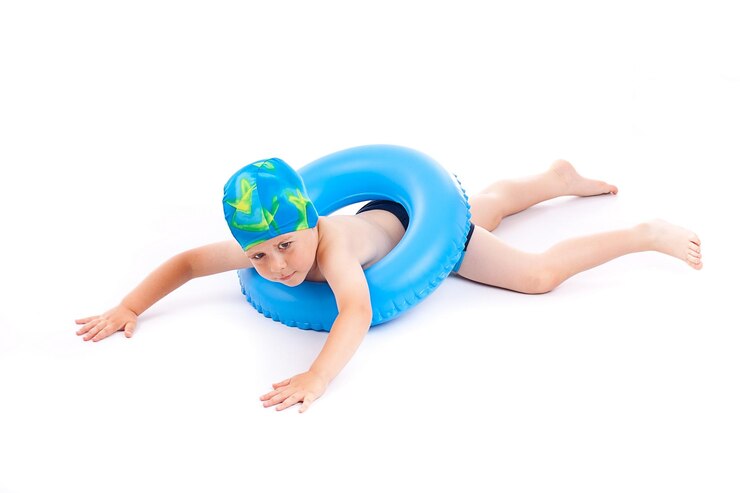 Boy playing with blue life ring