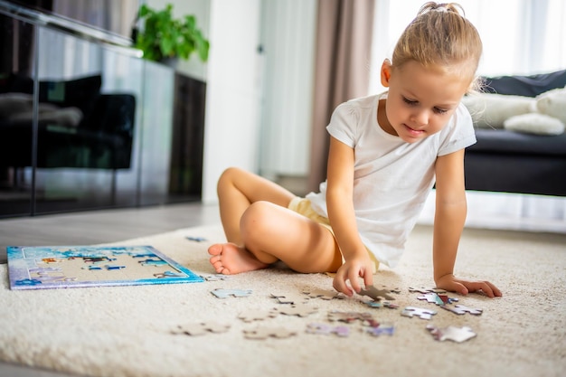 Boy playing with jigsaw puzzle at home