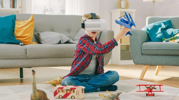 A boy playing with a virtual reality headset