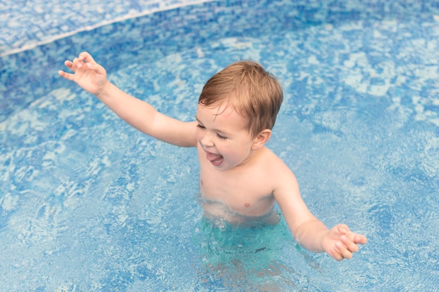 Boy in pool having fun