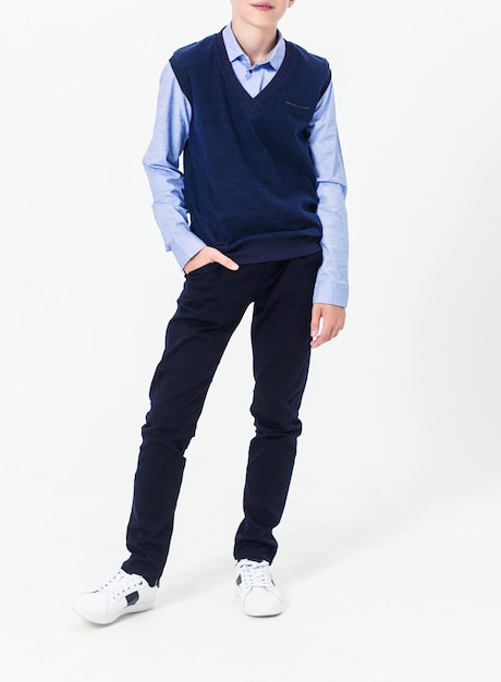 Boy posing in school uniform on white background Vertical photo