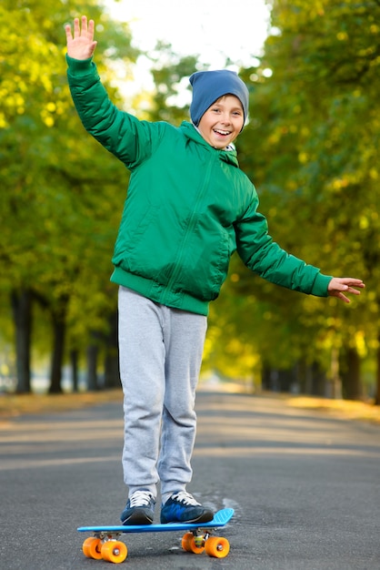 Boy posing on skateboards outdoors