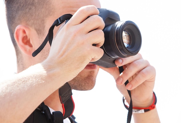 Boy posing with camera in studio