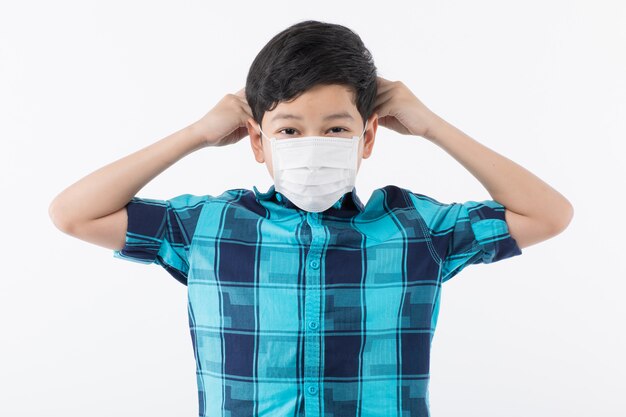 Boy preparing for wearing mask