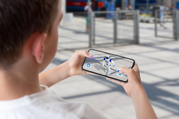 Photo boy programs and controls the robot on the street via augmented reality technology concept