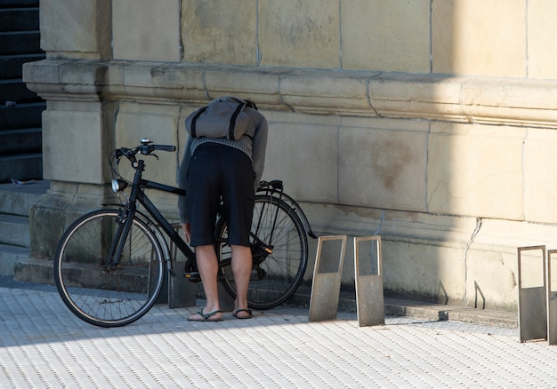 boy putting the lock to the bicycle