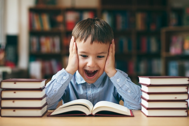 Boy reading with enthusiasm