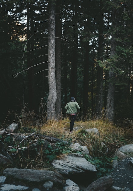 A boy running through the forest