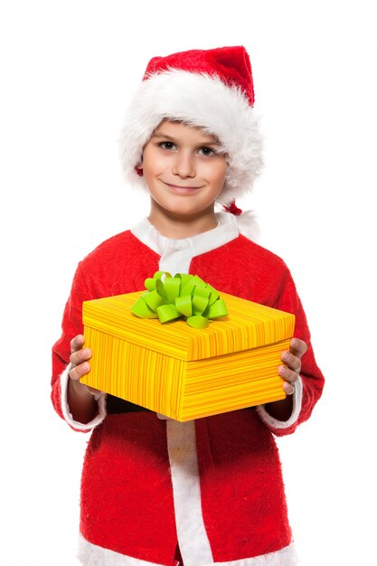 Boy Santa Claus is holding a christmas gift