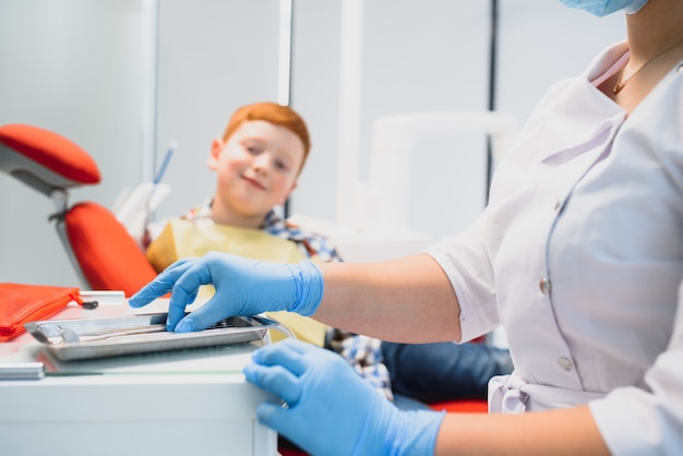 Boy satisfied with the service in the dental office. concept of pediatric dental treatment