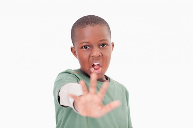 Boy saying stop with his hand