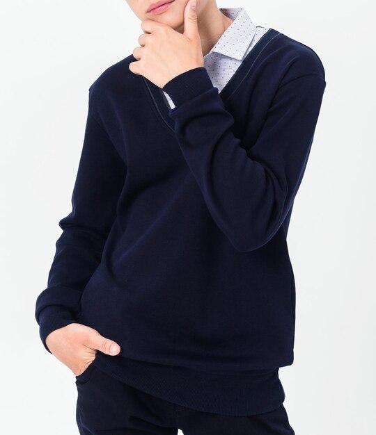 Boy in school uniform on white background Vertical photo