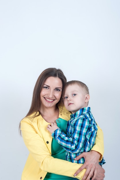 Boy in shirt sitting with mom 