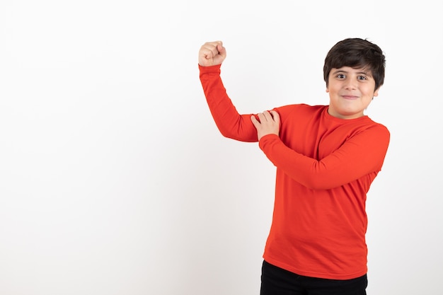 Boy shows hand strength