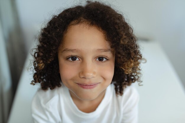 Boy sitting on bed in the ward at hospital