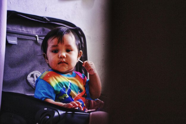 Boy sitting at home