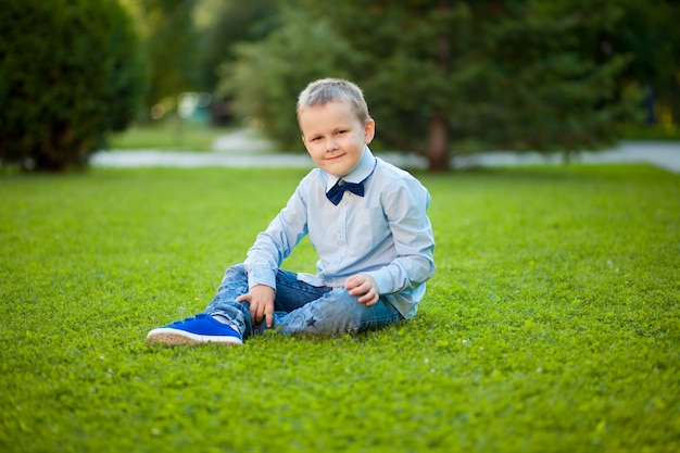 Boy sitting on the lawn