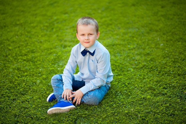 Boy sitting on the lawn