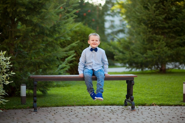 Boy sitting in the Park on a bench