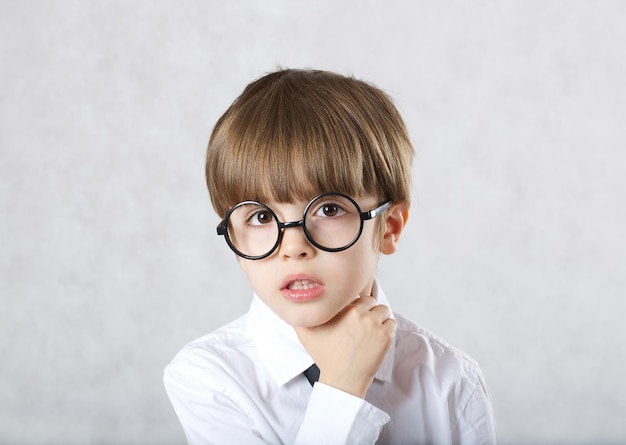 Boy of six years has pain in the throat. Closeup