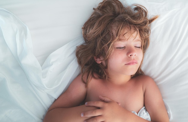 Boy sleep. Adorable Child sleeping in the bed.