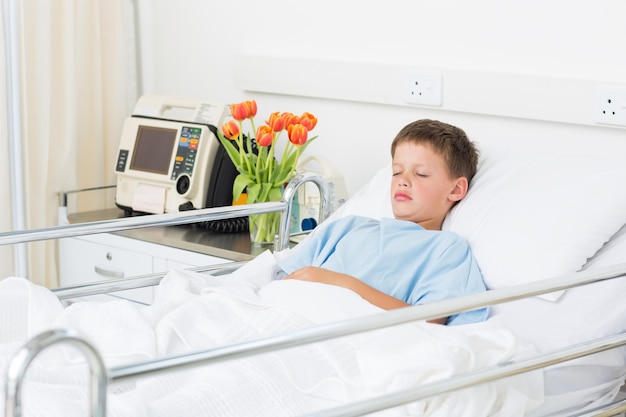 Boy sleeping in hospital ward