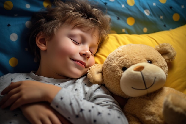 Photo boy sleeps sweetly in bed with a toy bear in his arms under the blanket