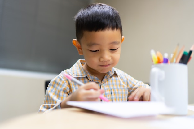 Boy do and smile on his  homework is easy