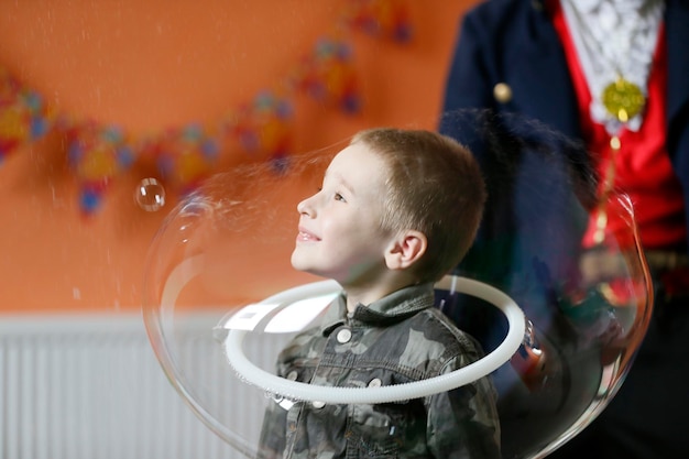 The boy in the soap bubble Child have fun at the party