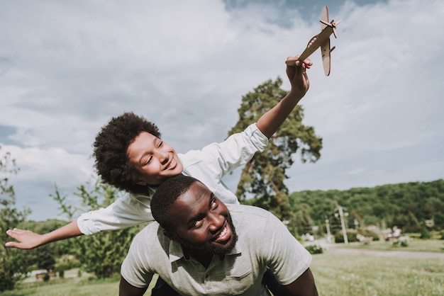 Boy Spread his Arms and Play with Plane with Dad