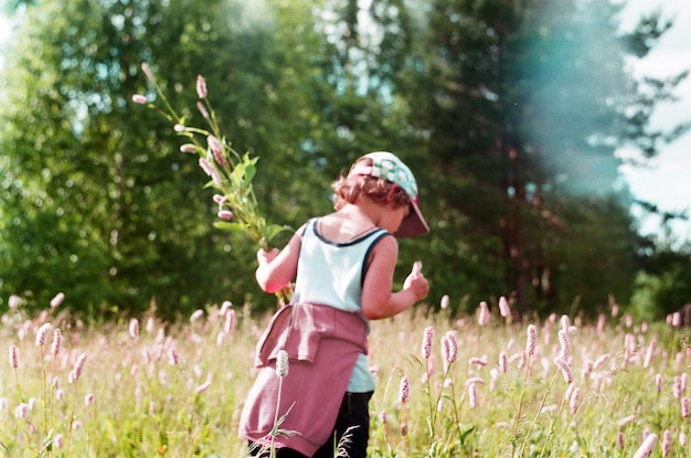 boy standing on field
