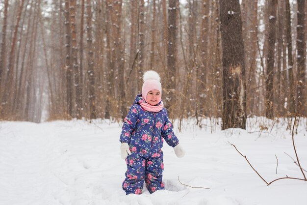 Boy standing on snow covered land