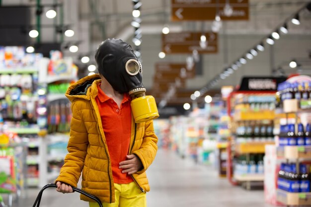 Boy in a store in personal protective equipment