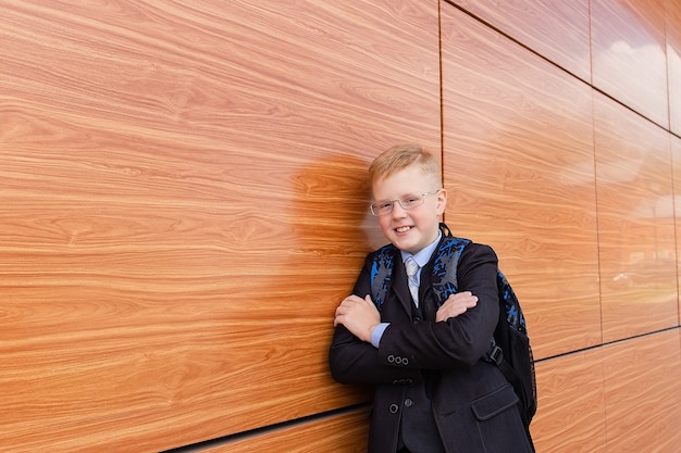  boy student near school on  street