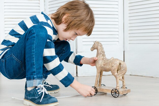 Boy in stylish clothes posing in the Studio