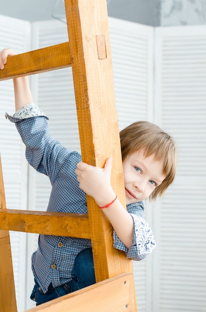 Boy in stylish clothes posing in the Studio