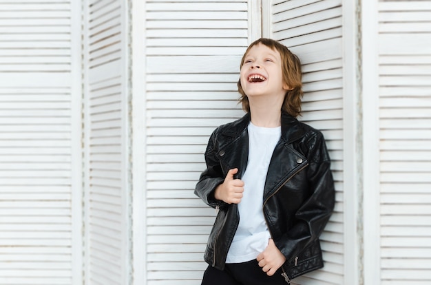 Boy in stylish clothes posing in the Studio