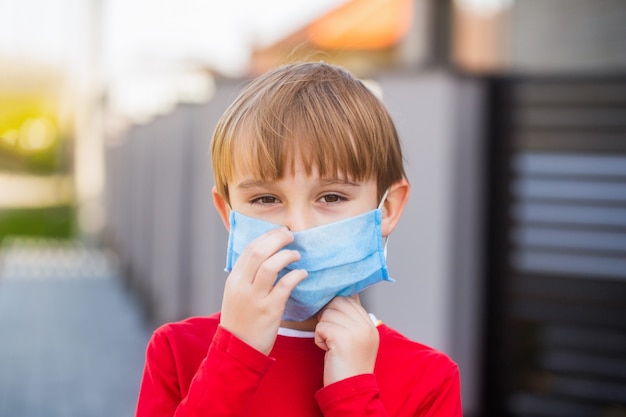 Boy in a surgical bandage. Coronavirus, illness, infection, quarantine, medical mask.