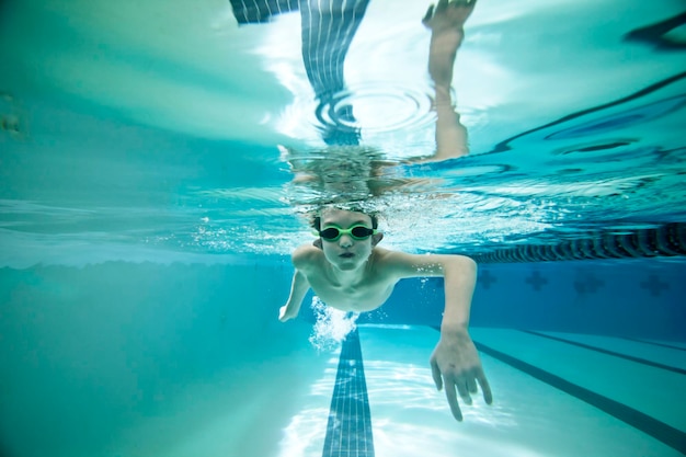 Boy swimming laps under water