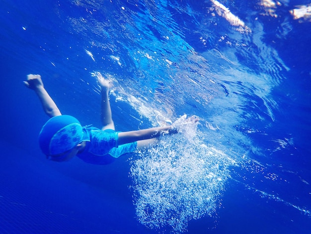 Boy swimming in pool