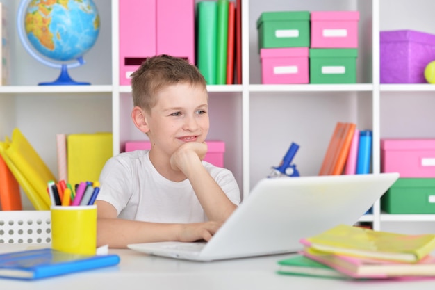 Boy using modern laptop