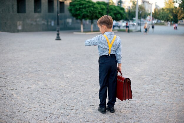 Boy verifying time waiting for a partner