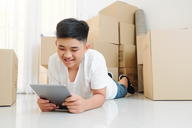 Boy watching cartoon after moving in