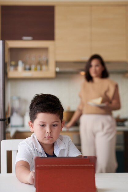 Boy Watching Cartoons on Tablet Computer