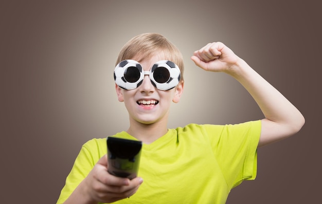 Boy watching football match on TV