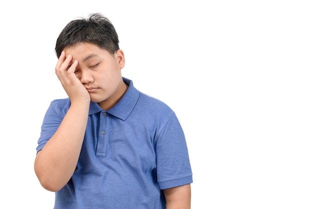 Boy wear blue polo shirt bored or sleep isolated on white background, emotion concept