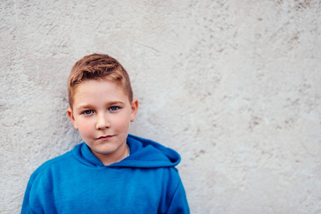 Boy wearing blue hoodie