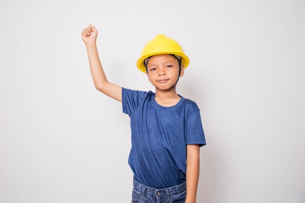 Boy wearing yellow hat engineer idea