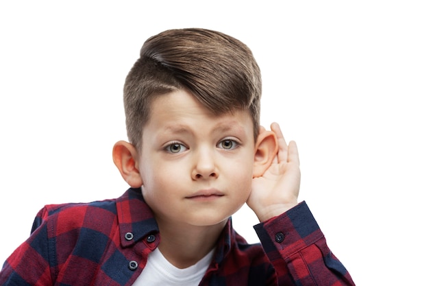 A boy with big ears is listening. Close-up. Isolated on white .