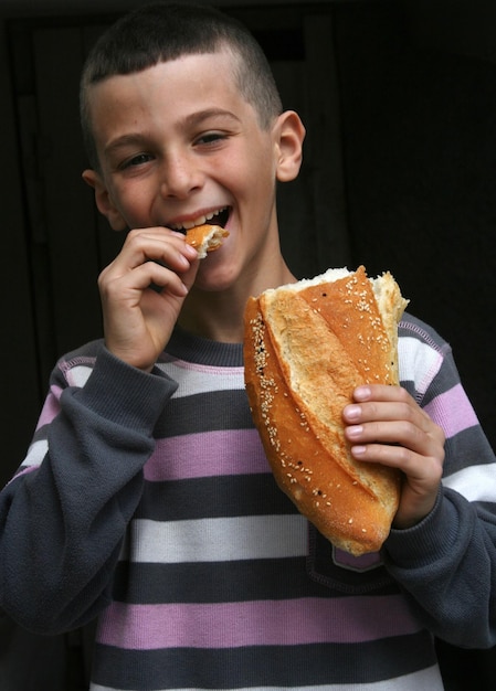 boy with bread in hand